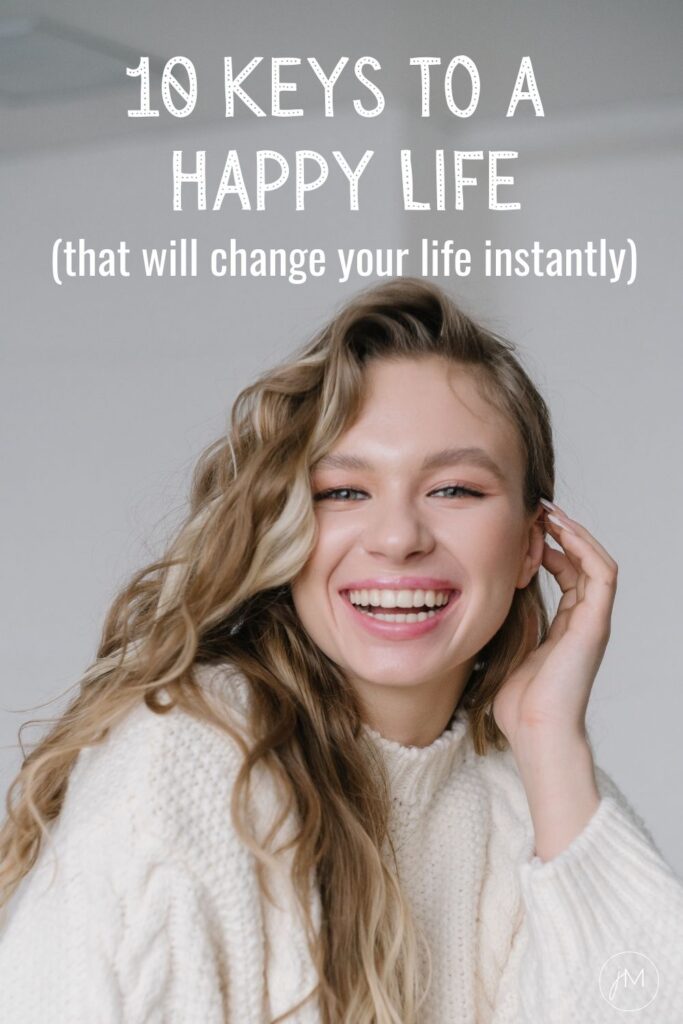 young woman with blonde hair smiling into camera