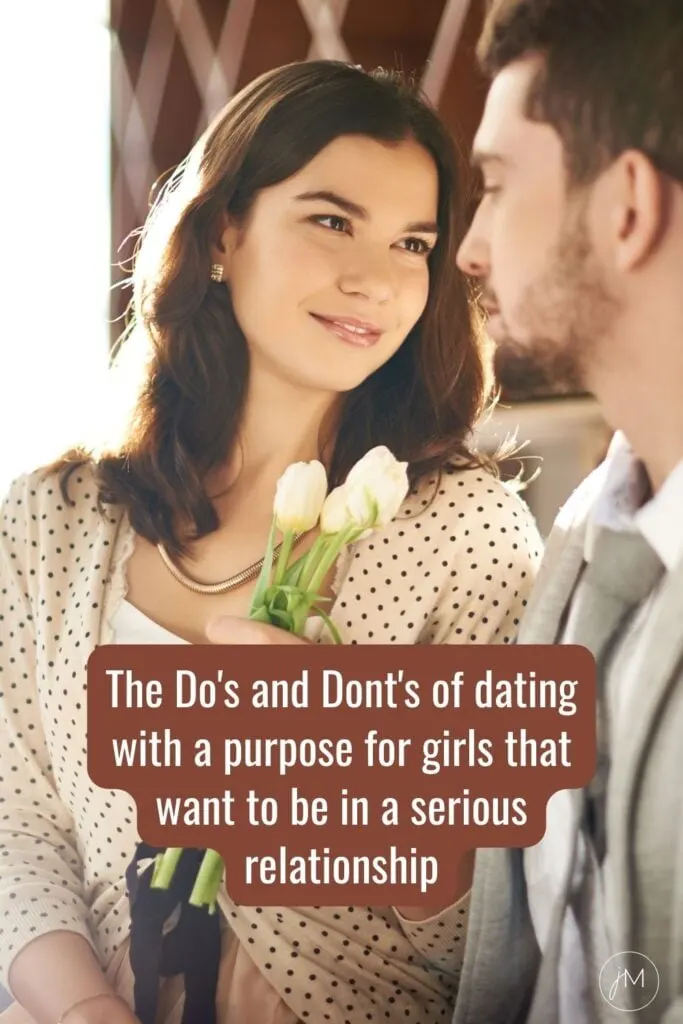 man and woman staring lovingly into each others eyes while holding tulips
