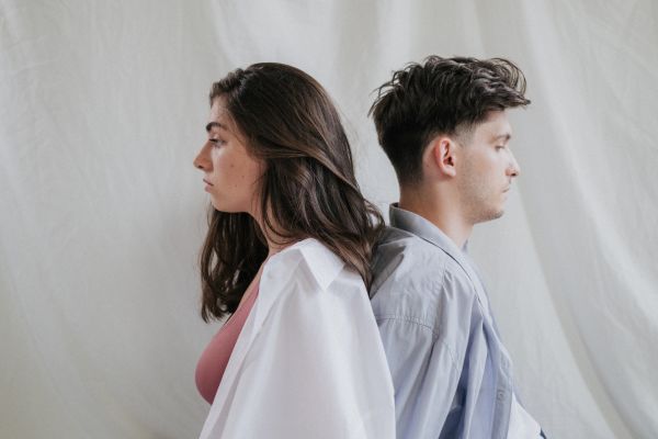 young couple facing away from each other