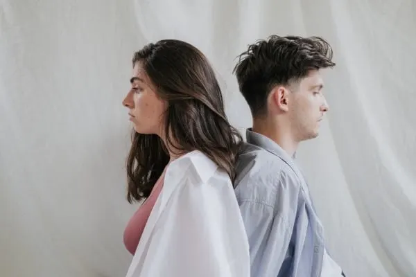 young couple facing away from each other