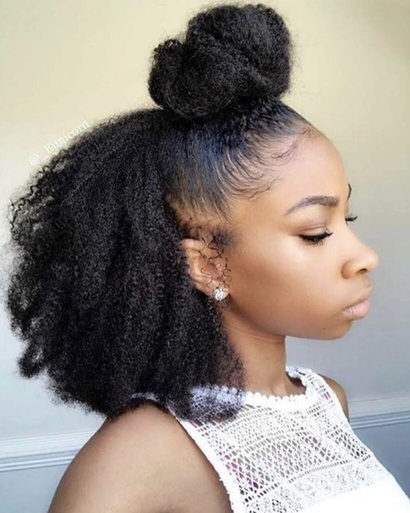 black girl with a half up half down natural hairstyle