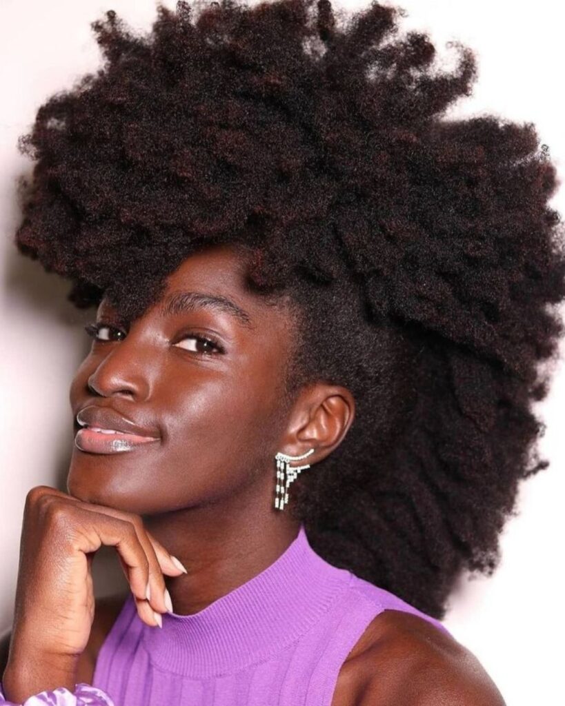 side angle of young black woman with a frohawk