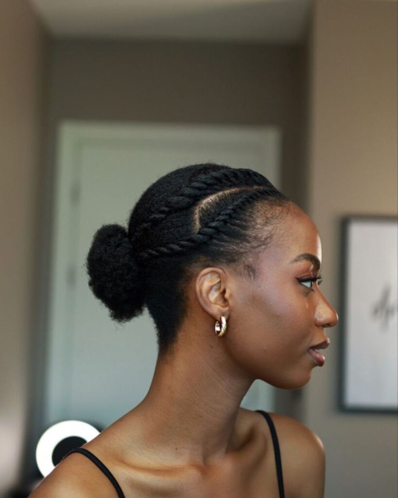 side angle of a black woman with a flat twist hairstyle