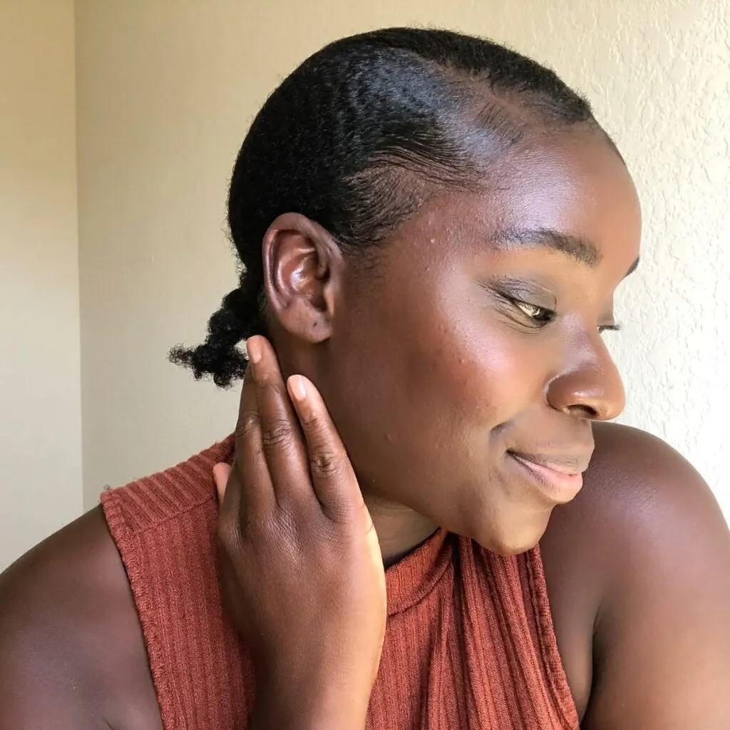 young black woman with her slicked down