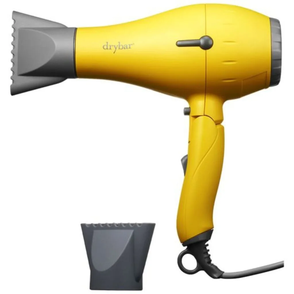 Beautiful yellow Drybar Buttercup Blow-Dryer in front of white background