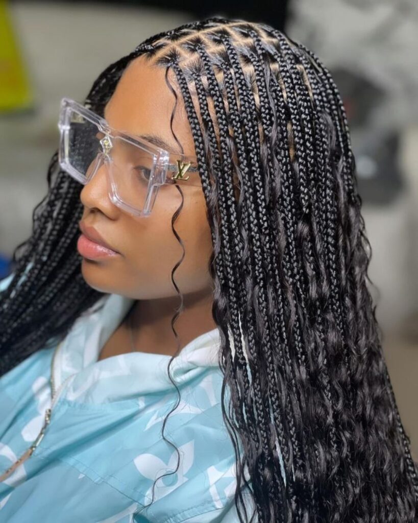 woman in salon chair with goddess knotless braids