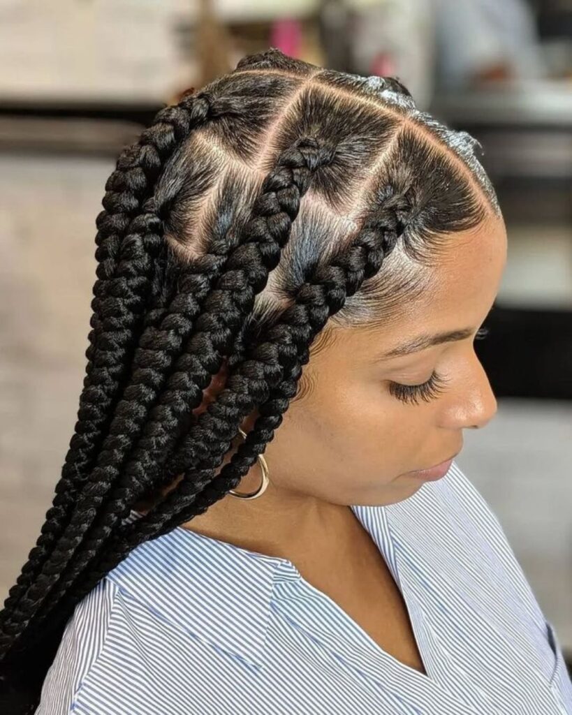 Black woman at the hair salon with jumbo knotless braids