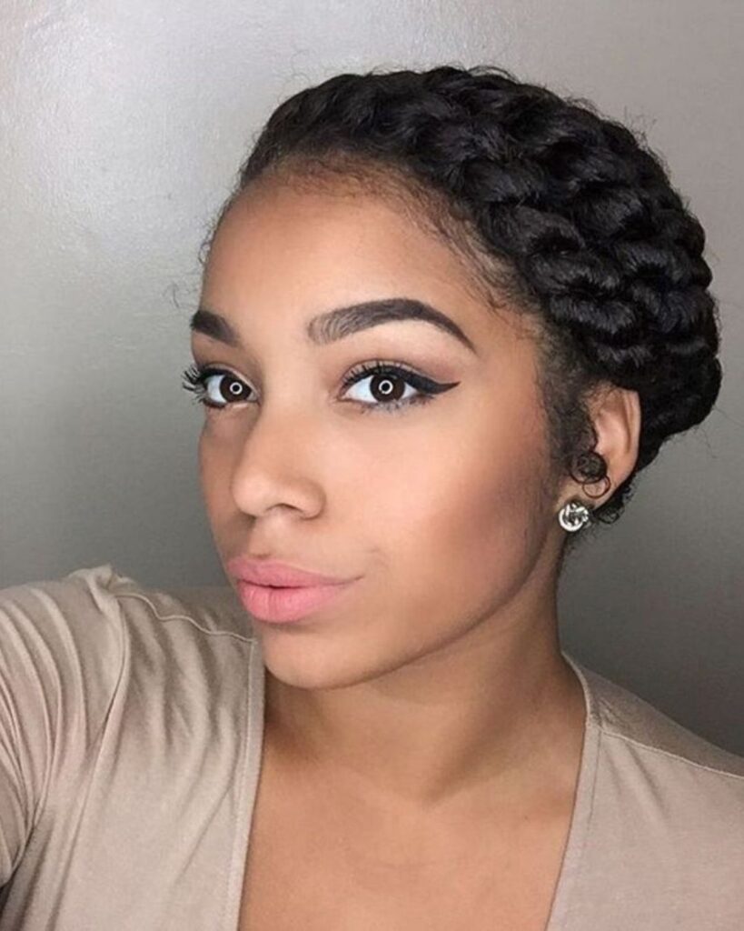 light skin black woman with a double halo braid