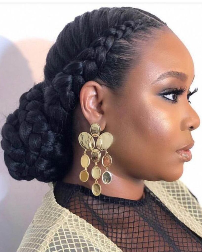 Elegant black woman with a halo braid hairstyle