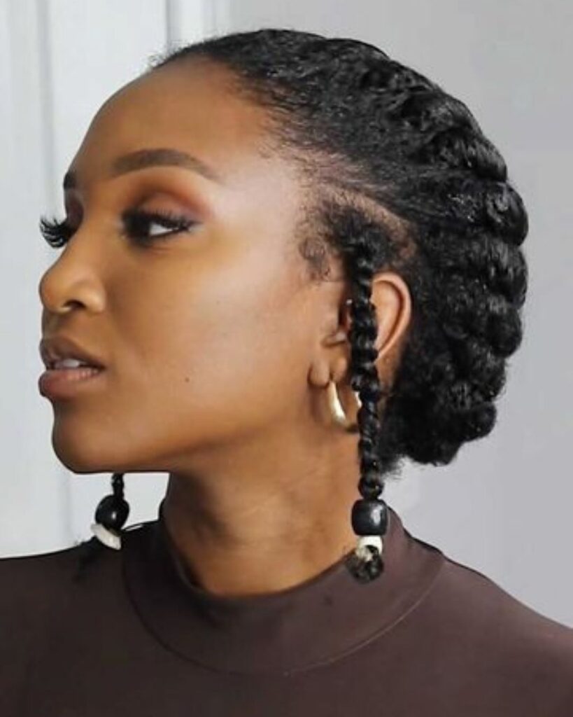 side profile of black women with a twisted halo hairstyle