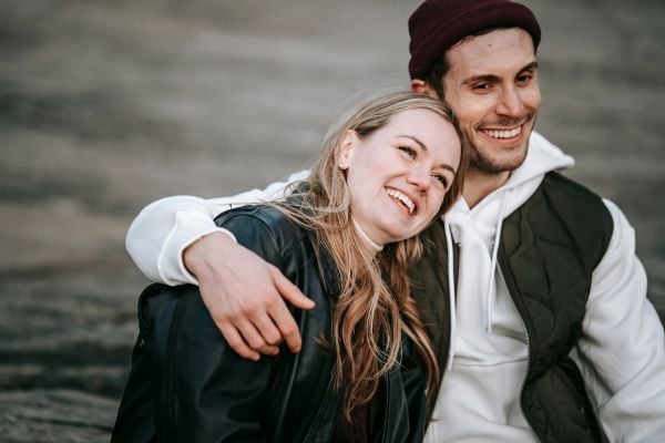 young couple hugging and smiling