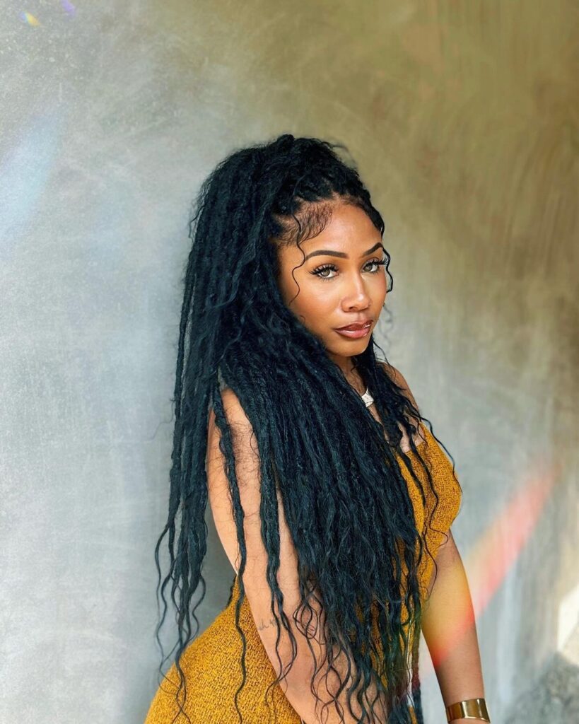 young black woman with long distressed faux locs
