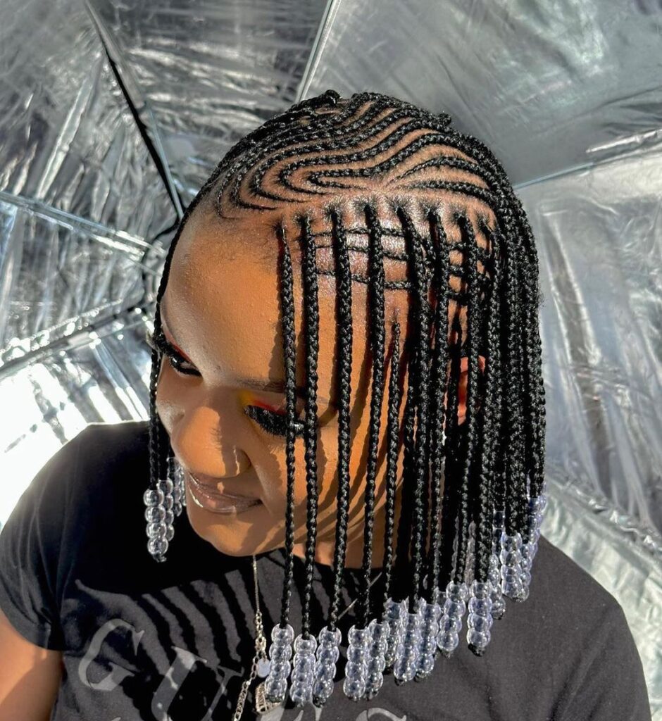 black woman showing off short flip over fulani braids