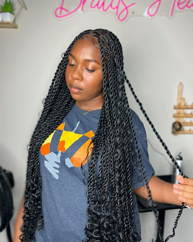 young woman in salong with black long island twist hairstyle
