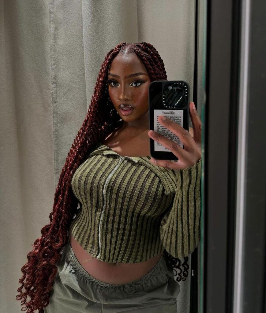 young black woman with long red island twists