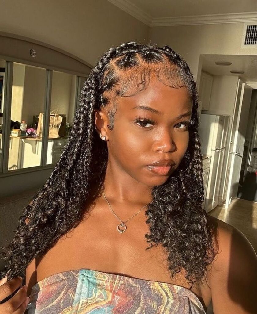 beautiful young black woman with short natural hair box braids with curly ends