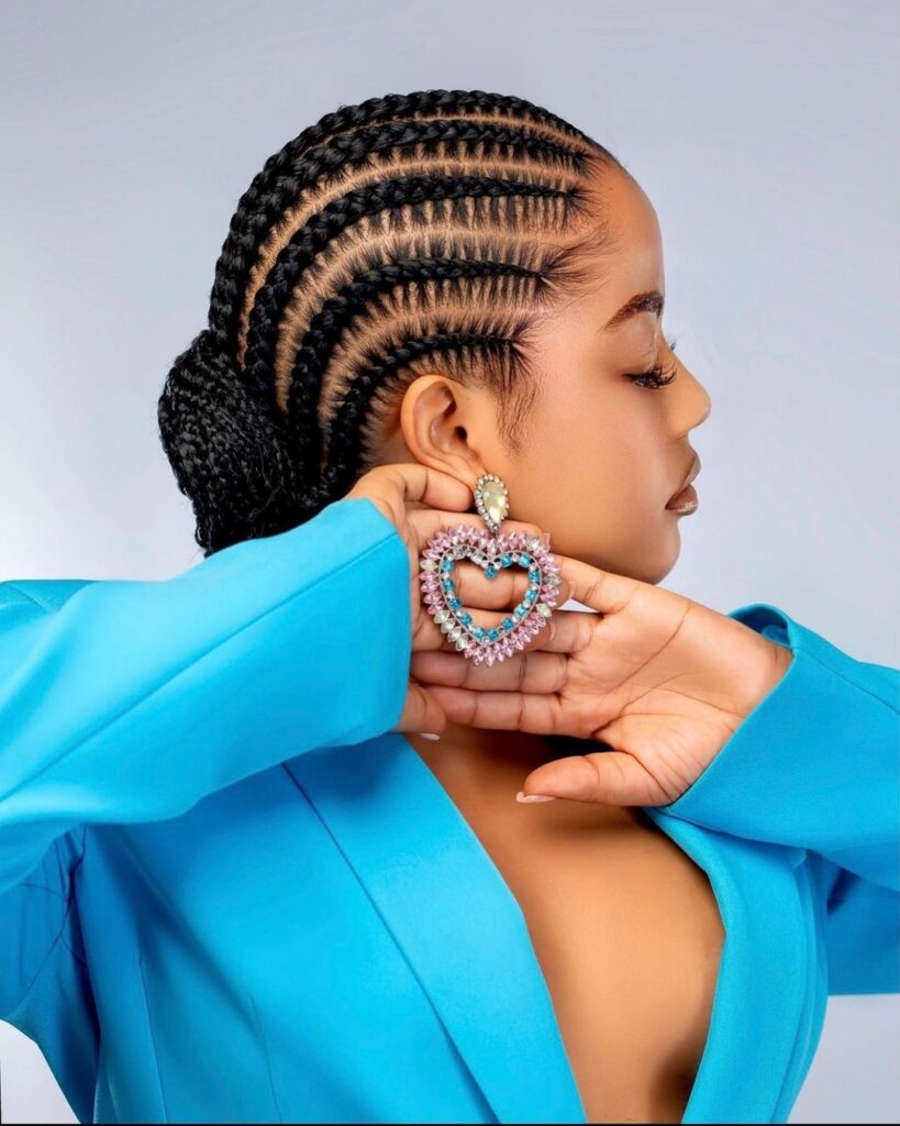 young black woman with straight back stitch braids